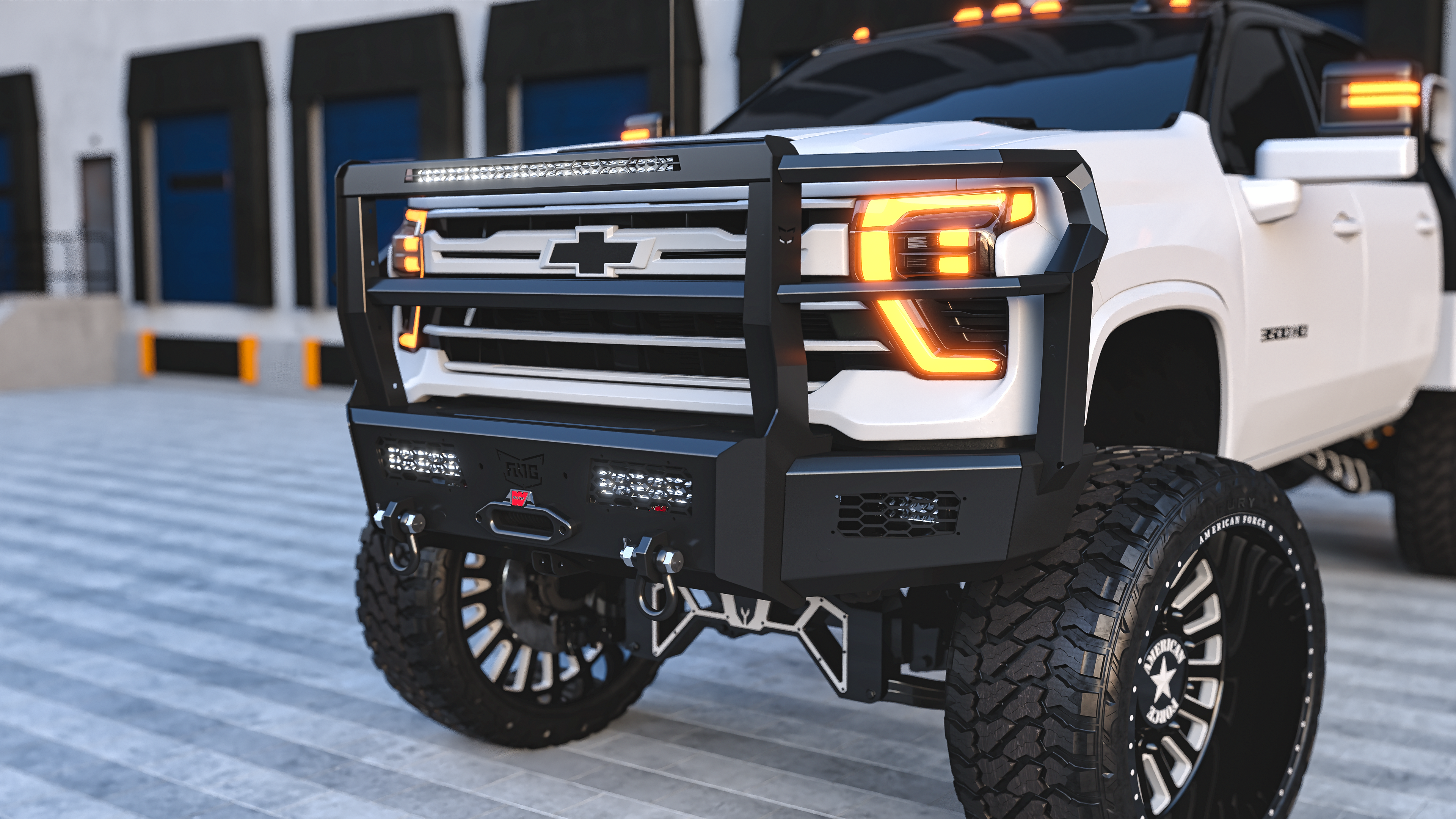 White 2026 Chevy 3500 with a heavy-duty ranch bumper on a Custom suspension lift with american force wheels.